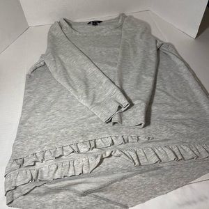 Camiseta manga largas con vuelos al final